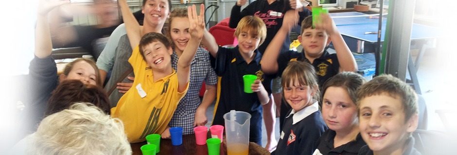 Group of school children drinking juice